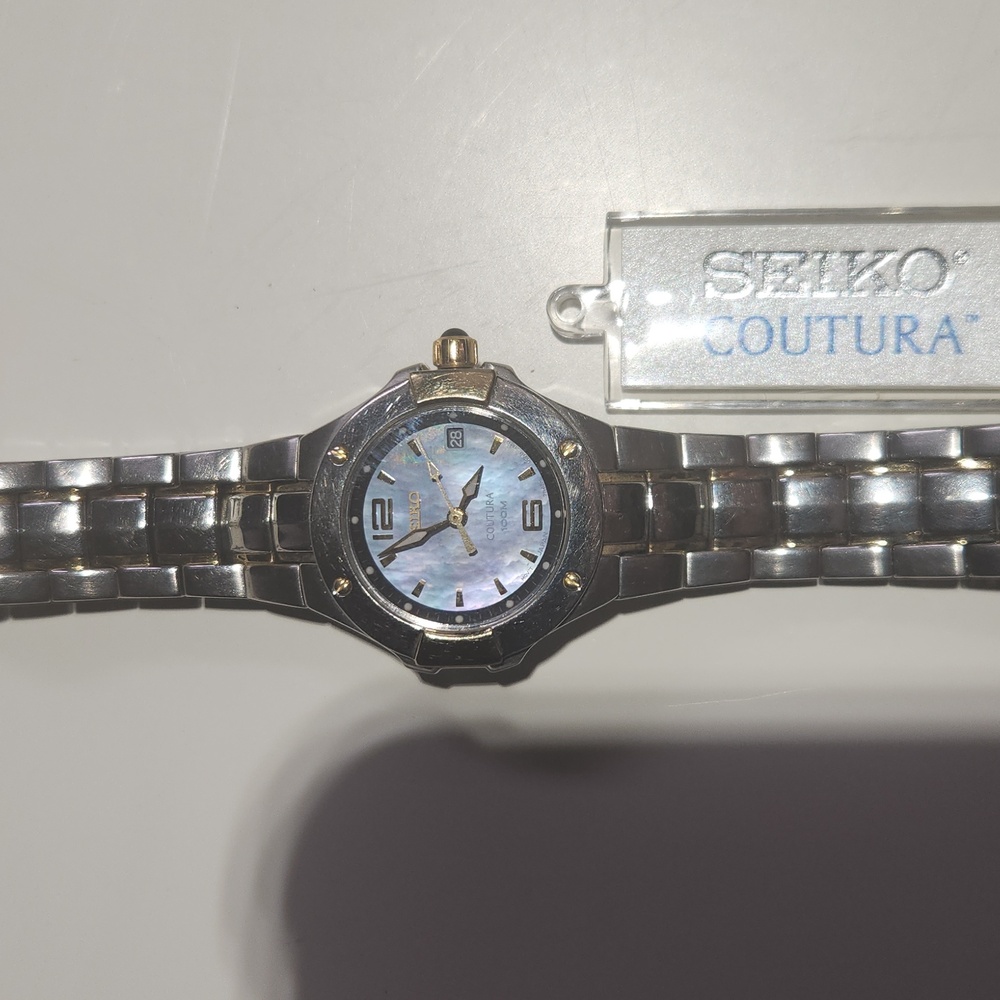 Seiko, silver with gold accent chain link, size small.